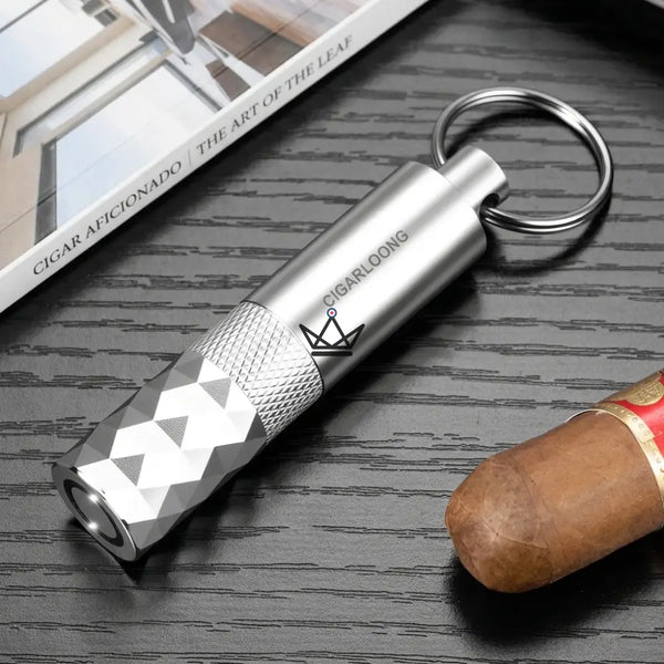 Diamond-faceted cigar punch keychain, 5 colors — FACETTE, Money