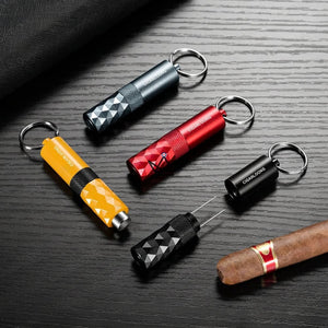 Diamond-faceted cigar punch keychain, 5 colors — FACETTE